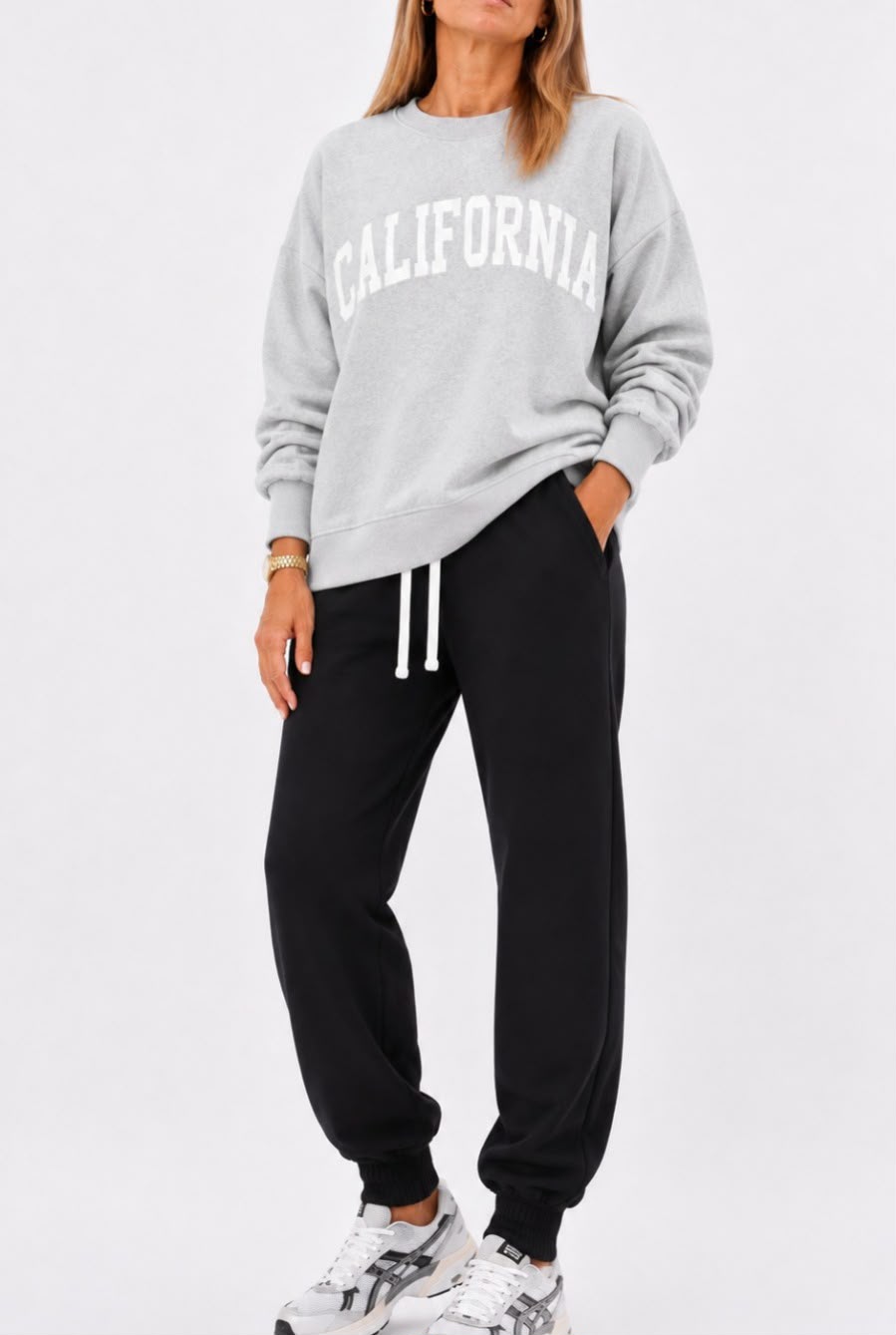 Pantalón deportivo negro con buzo California gris
